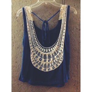 Super cute lace back tank top.